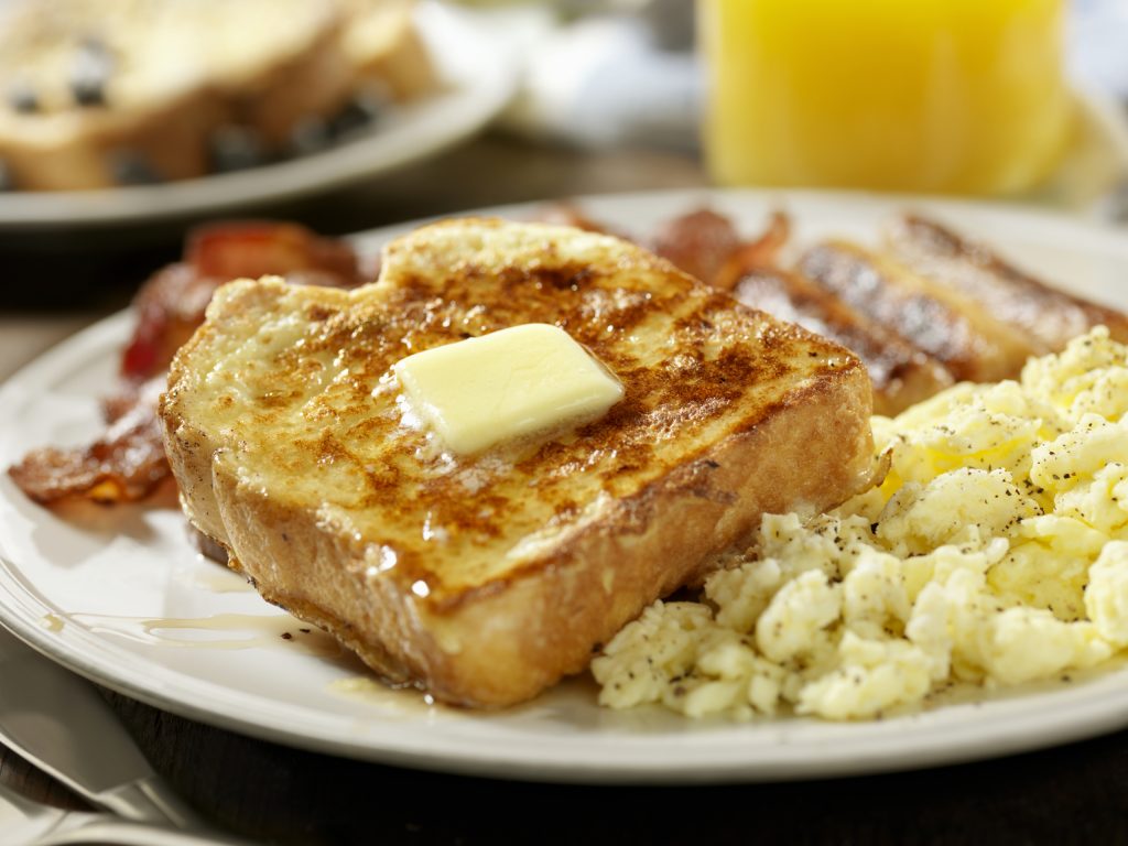 french toast with eggs, bacon and sausage