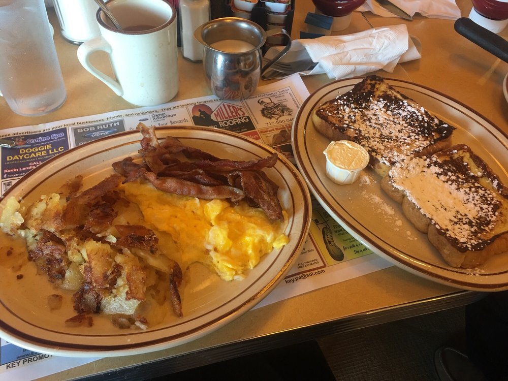omelette with bacon and home fries with french toast and coffee